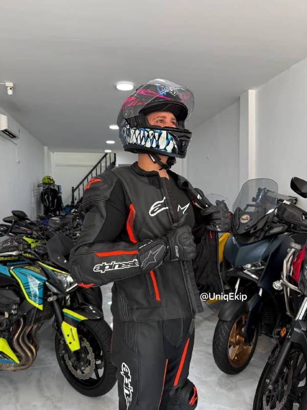 Rider in full leather gear at a Nha Trang garage